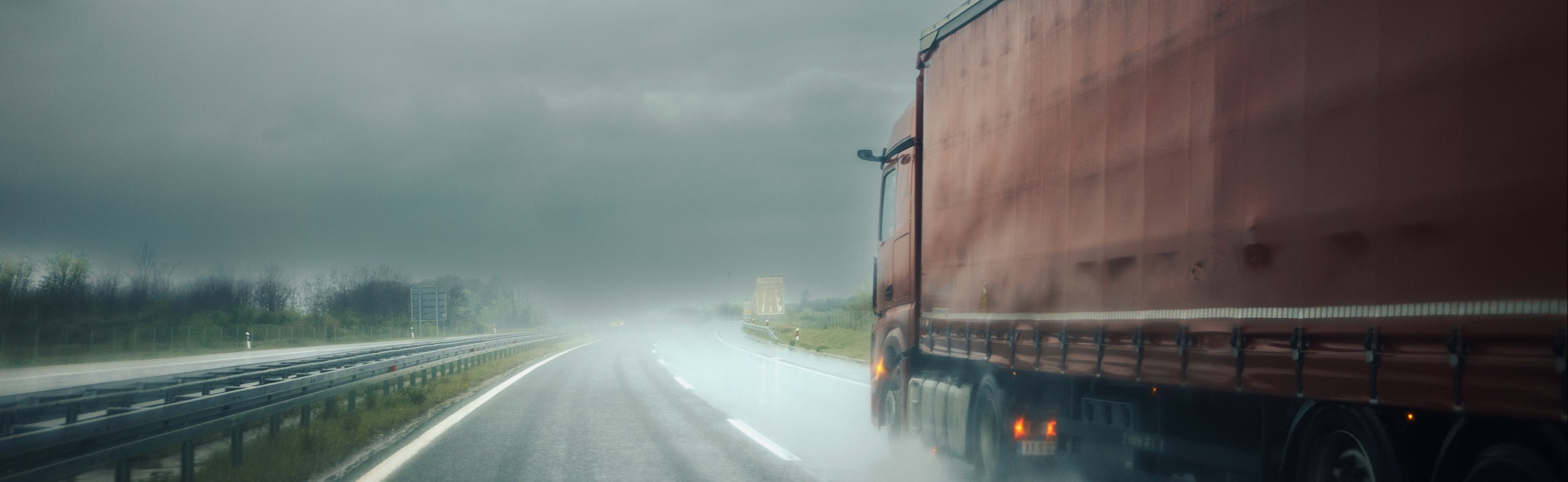 Truck driving in bad weather. 